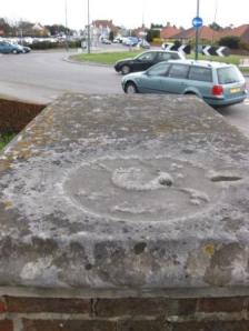 Not much remains of the skull and crossbones on the 'tombstone', 2010