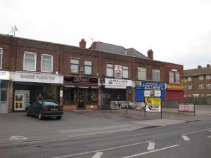 The roof of a house that Mr Gwillim built on his land can still be seen, incorporated into the shops of Wellington Parade, 2010